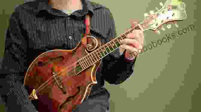 A Person Playing The Mandolin, A Small Stringed Instrument, With Ease And Grace. Classical Music Themes For Easy Mandolin Volume One