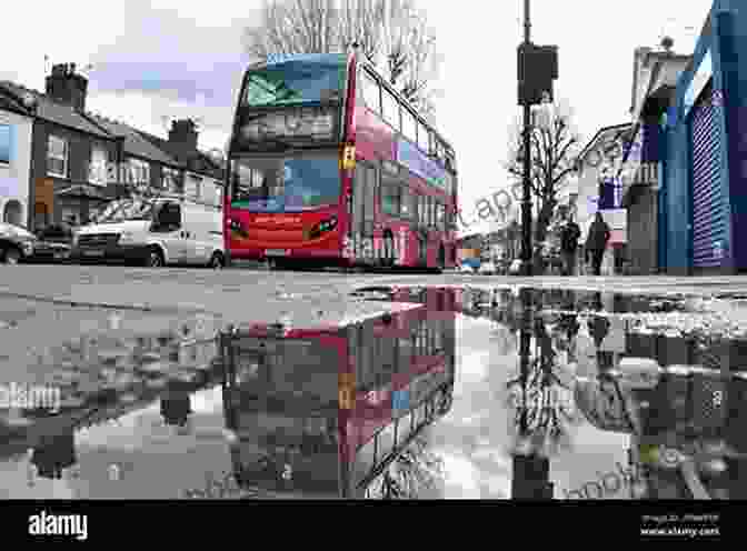 A Photograph Of A London Night Bus Reflected In A Puddle On The Street, Creating A Surreal And Dreamlike Atmosphere. London Night Buses Since 1984 Philip Wallis