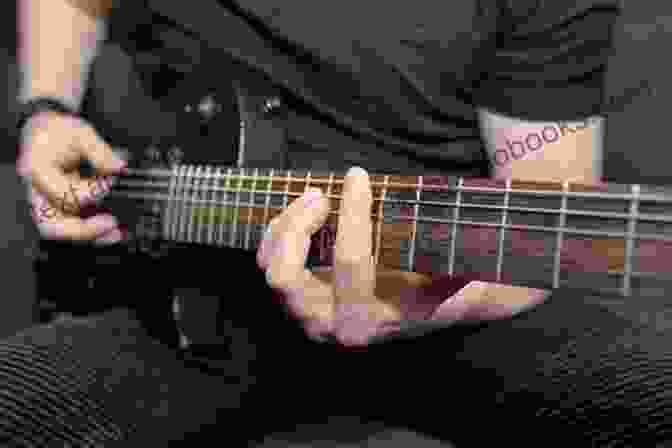 Close Up Of Person Playing Electric Guitar With Focus On Fretboard And Picking Hand Music Theory Bundle Of 2 7 Easy Steps To Read Music Circle Of 5ths Music Resource Book: Music Resource For Piano Guitar Ukulele Players