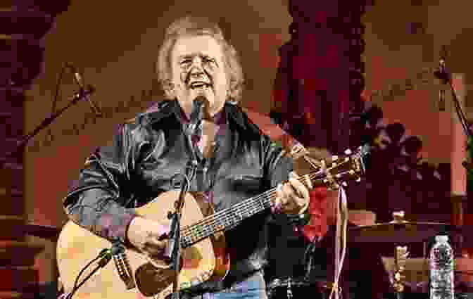 Don McLean Performing On Stage, His Guitar In Hand, A Rapturous Crowd Before Him. The Don McLean Story: Killing Us Softly With His Songs