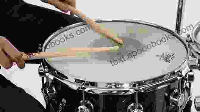 Drummer Experimenting With Different Muffler Materials To Control Overtones On A Snare Drum How To Tune The Drum: Start Learning To Play Professionally Drum: Musical Instrument Guide