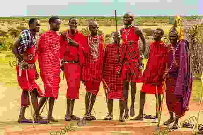 Maasai Warrior Adorned In Traditional Clothing, Standing Proudly Against A Scenic African Landscape. The Worlds Of A Maasai Warrior: An Autobiography