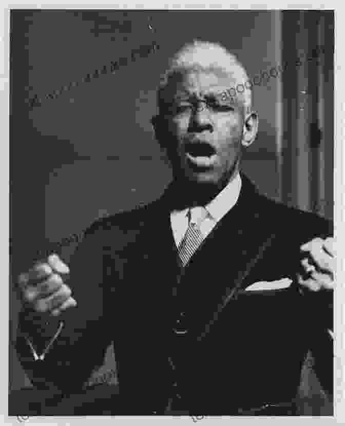 Roland Hayes Performing On Stage, Captivating His Audience With His Extraordinary Vocal Abilities. Roland Hayes: The Legacy Of An American Tenor